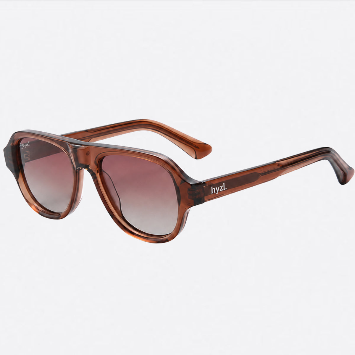 A pair of oversized square sunglasses with a translucent brown acetate frame and gradient brown lenses, featuring the brand name 'byzL.' on the temple, set against a plain light gray background.