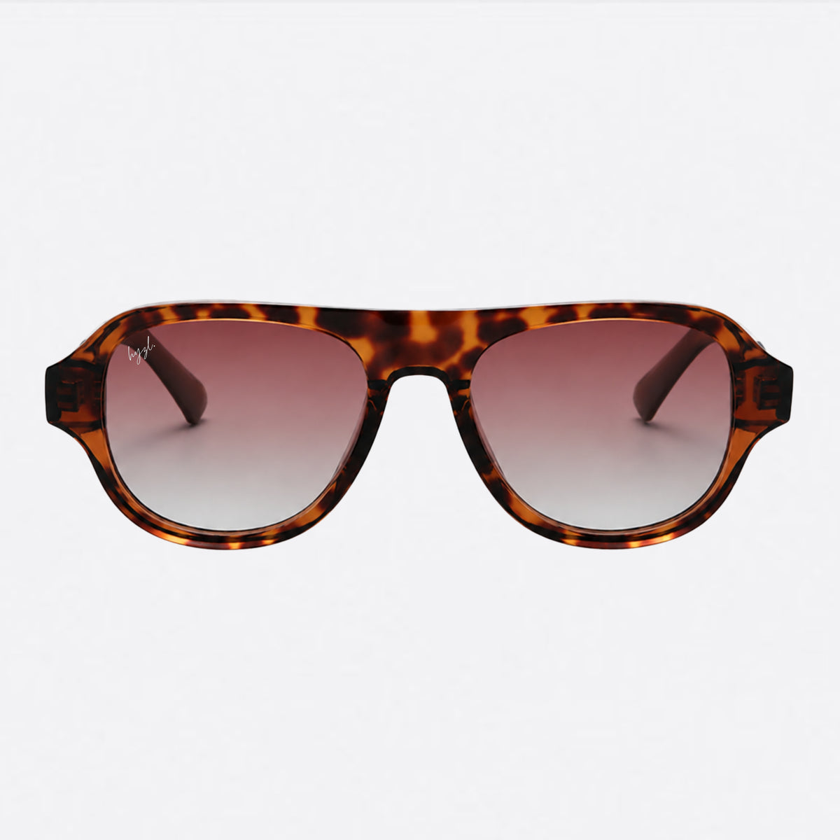 A pair of aviator-style sunglasses with a brown and black tortoiseshell frame and gradient pink-to-clear lenses, shown against a plain white background.
