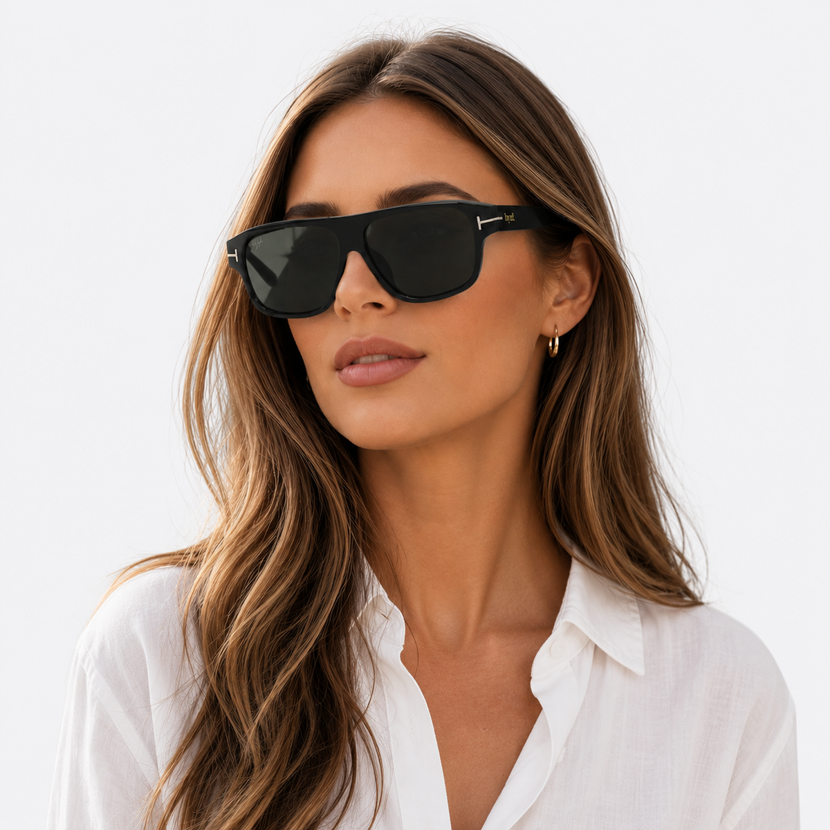 A woman with long brown hair wearing black rectangular sunglasses and a white collared shirt, photographed against a clean white background.