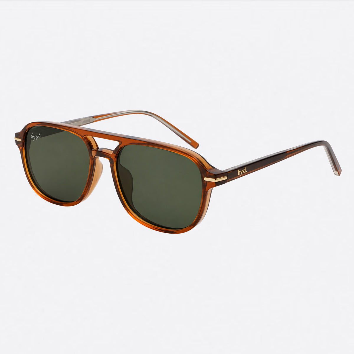 A pair of aviator-style sunglasses with a translucent amber-brown acetate frame and dark green lenses, shown on a clean white background.