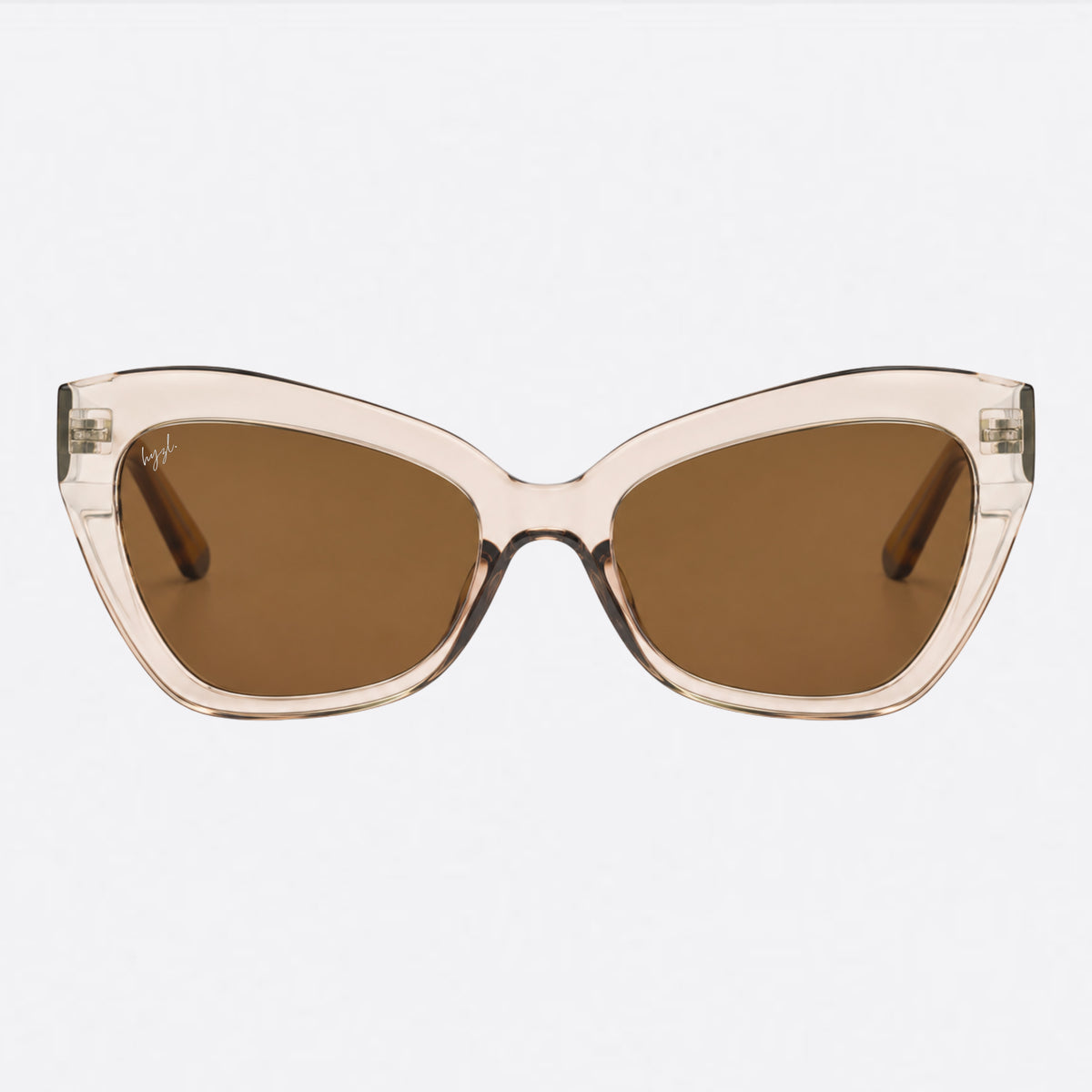 A pair of cat-eye sunglasses with translucent light beige frames and brown lenses, shown against a plain light gray background.