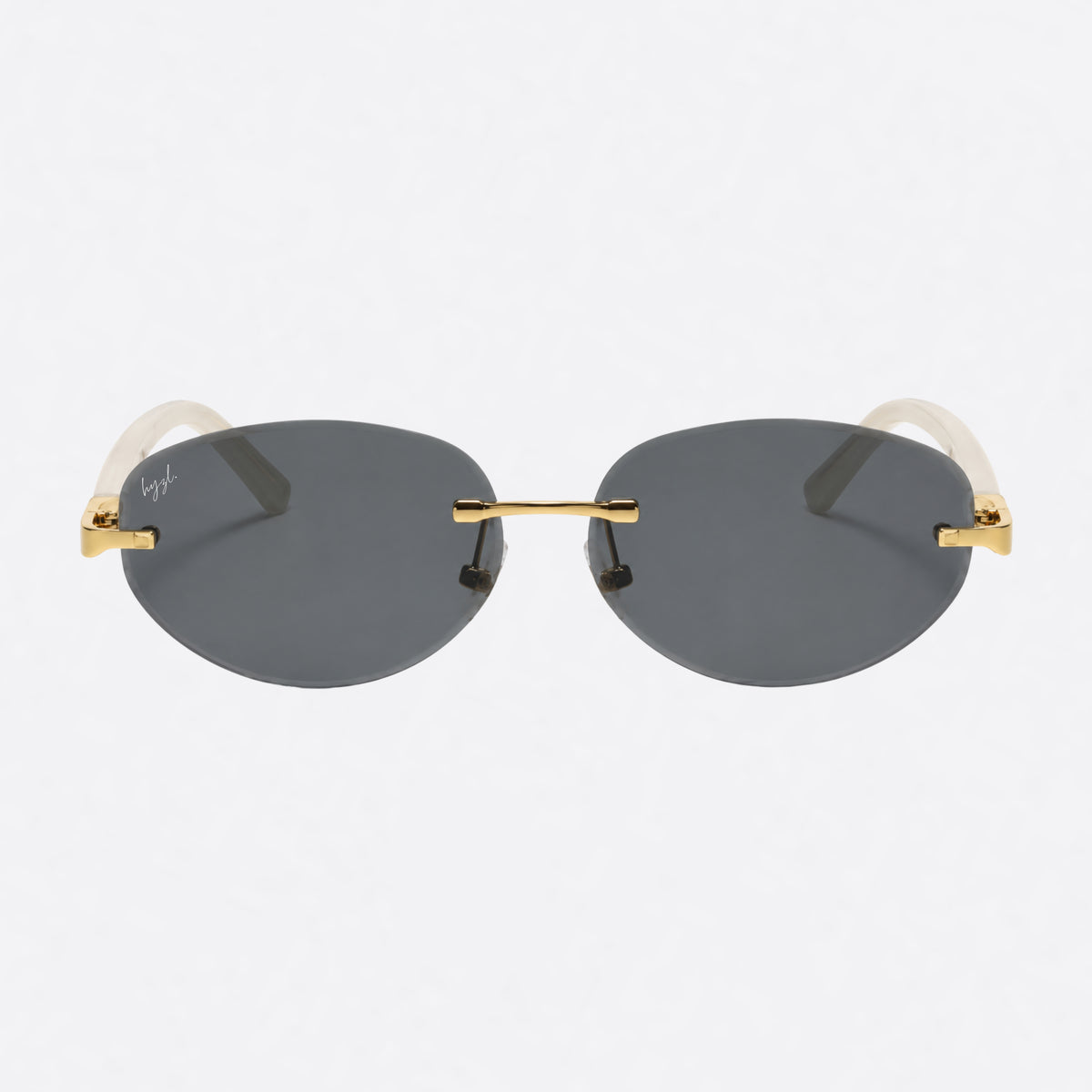 Rimless sunglasses with dark gray lenses, gold metal bridge and temples, and translucent cream acetate temples on a light gray background.