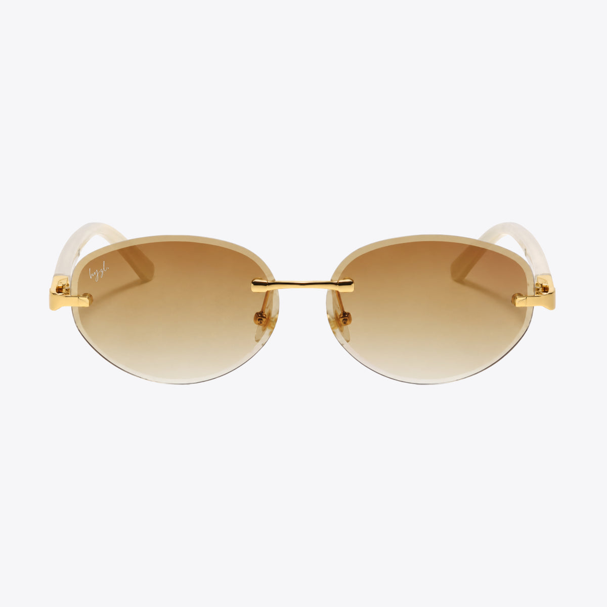 Oval sunglasses with gold metal rims, brown gradient lenses, and white temples, shown from the front on a light gray background.